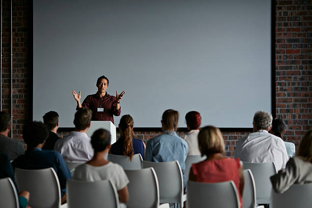 Speaker standing in front of an audience