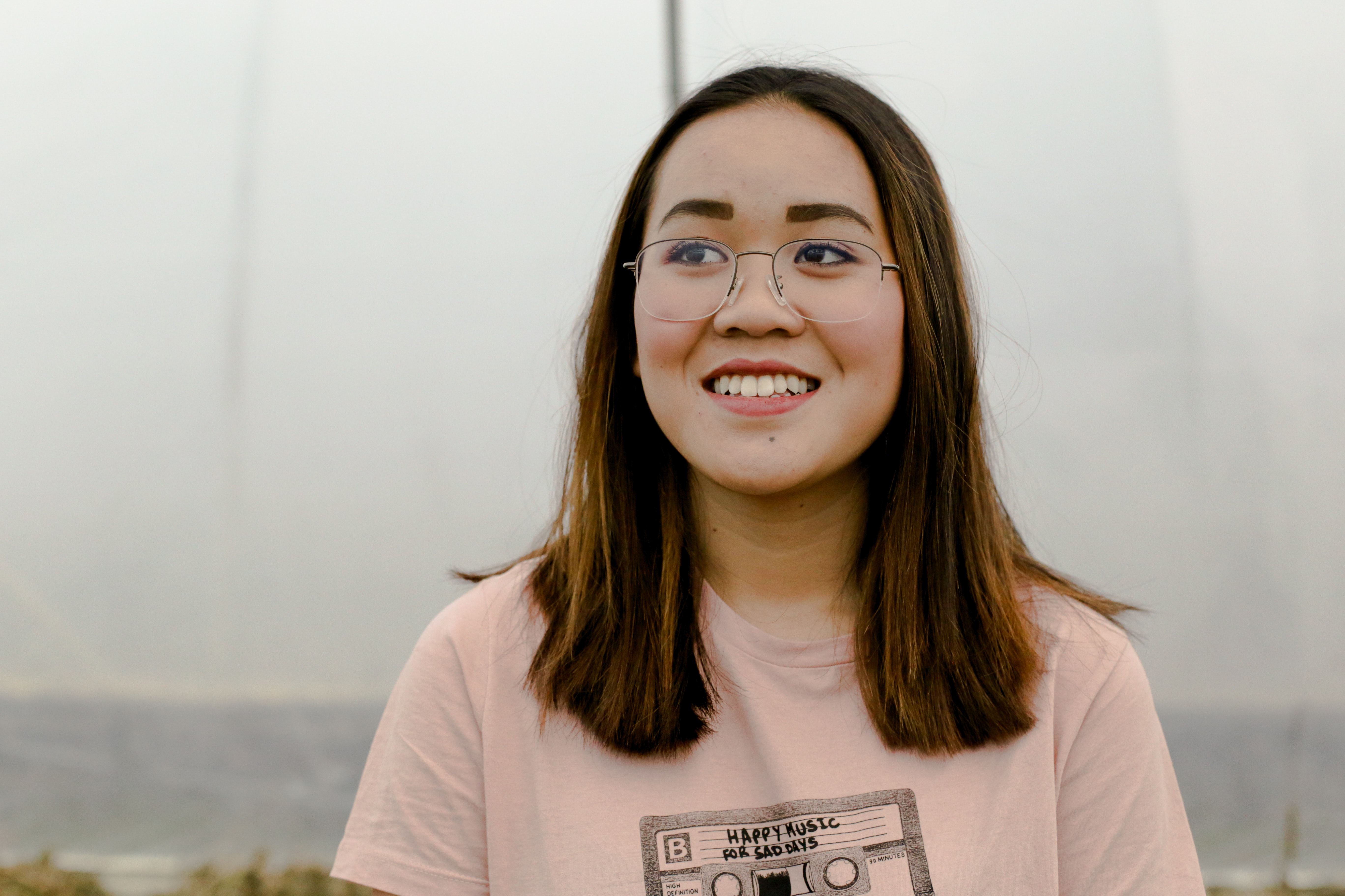 Young woman with glasses smiling