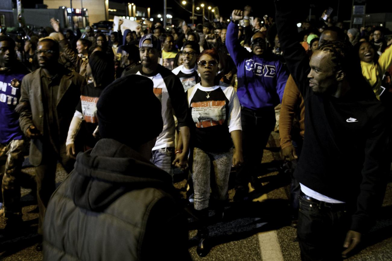 Leading a march during Ferguson October in 2014, Lezley McSpadden, Michael Brown’s mother, is in the center holding hands with her husband, Louis Head.