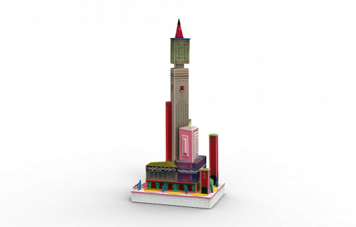 Colorful mixed media sculpture featuring a tall skyscraper rising above smaller urban buildings fashioned from cardboard, plastic, pins, pen and paint. 