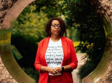 Ariana Curtis in front of an outdoor sculpture